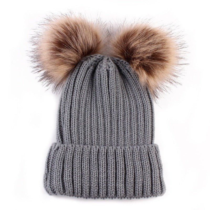 La boutique du chapeau Bonnet double Pompons en Fourrure